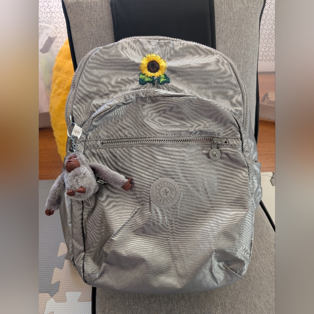 Kipling Silver Backpack with Sunflower Patch